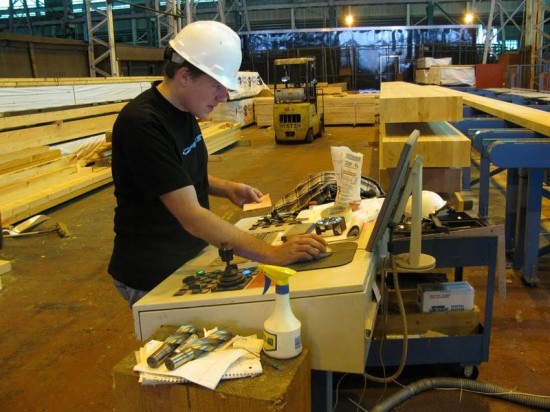 Engineer Working with Computer-aided Robotic Manufacturing Software Program to Fabricate Building Components for the IDEAbuilder Proof of Concept House. (Photo courtesy IDEAbuilder)