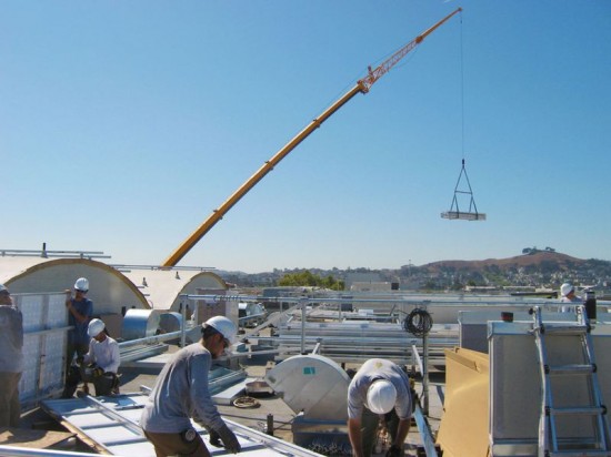 Borrego Solar loads 748 PV modules with a crane in one day at Mosaica. San Francisco, California. (Photo by David Potovsky)