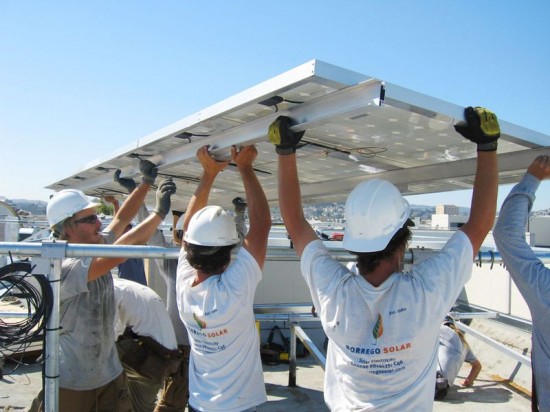 Borrego Solar’s crew members set PV modules at Mosaica. San Francisco, California. (Photo by David Potovsky)