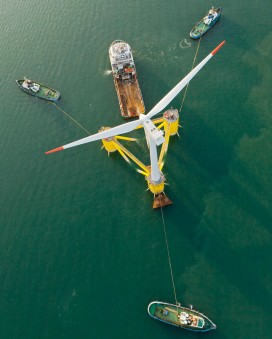 An overhead view of the WindFloat prototype in the Sado River, Portugal during ballasting and connection to the offshore tug vessel Bourbon Liberty 228.  (Photo courtesy Principle Power Inc.)