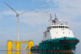 The WindFloat prototype in the Sado River, Portugal during ballasting and connection to the offshore tug vessel Bourbon Liberty 228.  (Photo courtesy Principle Power Inc.)