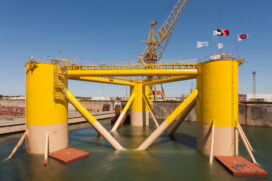 The first prototype float for the WindFloat in the process of being moved from its berth to the end of the drydock for turbine installation.  (Photo courtesy Principle Power Inc.)