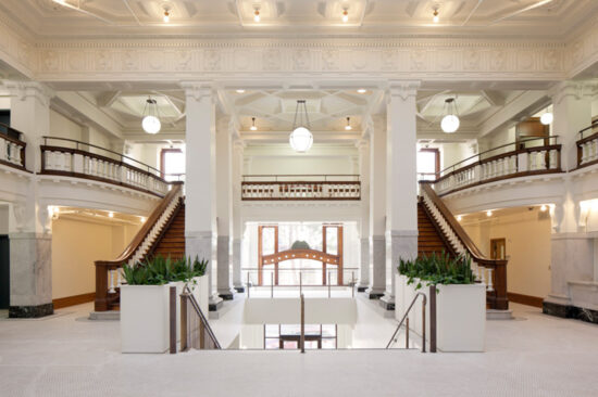 Kelly Cullen Community’s two-story lobby retains much of its original architectural details and has been restored to its original glory. (Photo by Mark Luthringer)