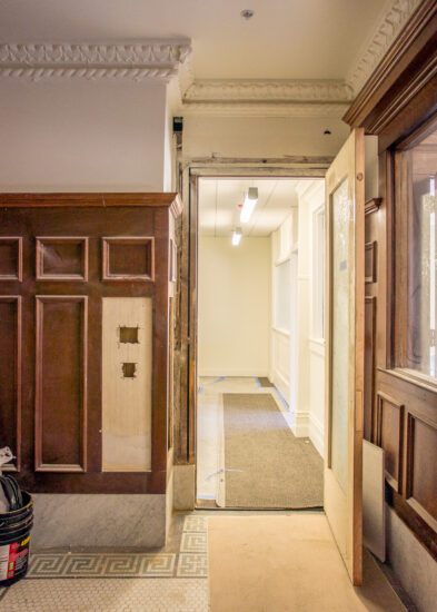All the crown molding and wood paneling throughout the building were retained and underwent a facelift. (Photo by Oliver Shay)