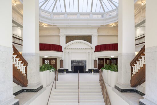 The grand staircase at the Central YMCA was removed in the 1950s. The restoration process at Kelly Cullen Community’s two-story lobby brought back a newly built grand staircase. (Photo by Mark Luthringer)