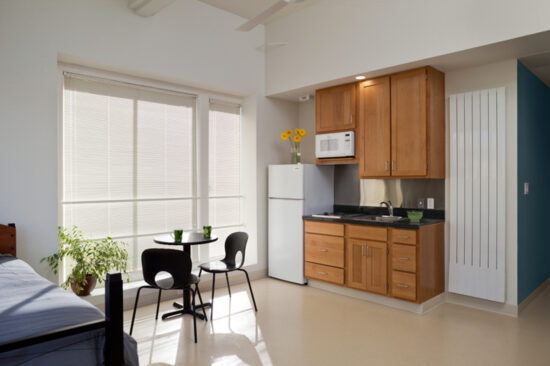Each studio apartment at Kelly Cullen Community has an accessible or adaptable kitchen and bathroom, low toxic finishes, and plenty of daylight. (Photo by Mark Luthringer)